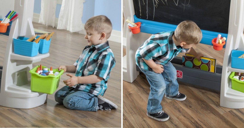 kid playing with a step2 easel