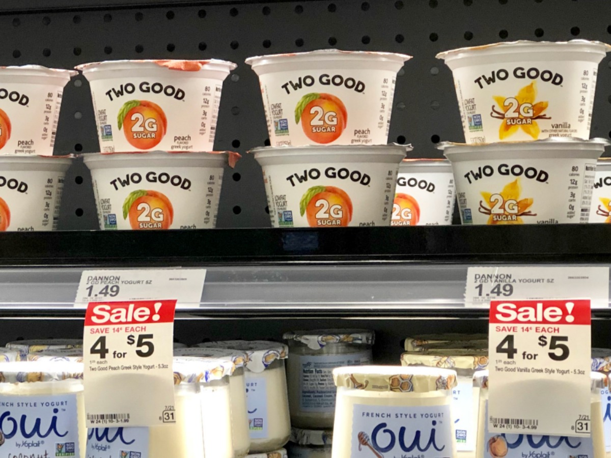 store shelf showing price tags and Two Good and Oui yogurt cups