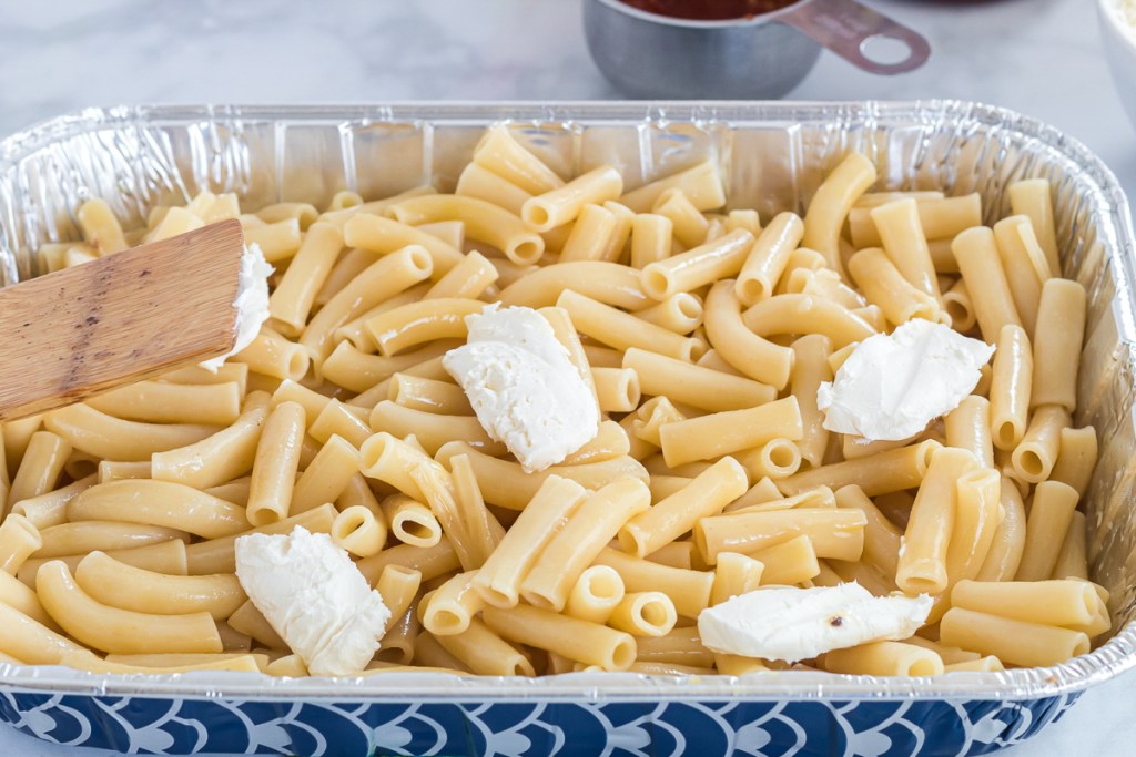 adding cream cheese to pasta