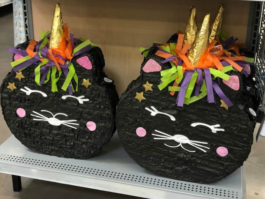 black cat unicorn pinatas on store shelf