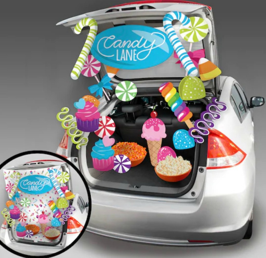 Candy themed Trunk or Treat decor kit set up in silver sedan trunk