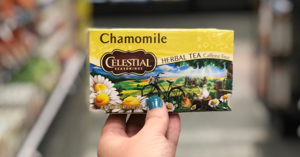 woman holding celestail tea box at target