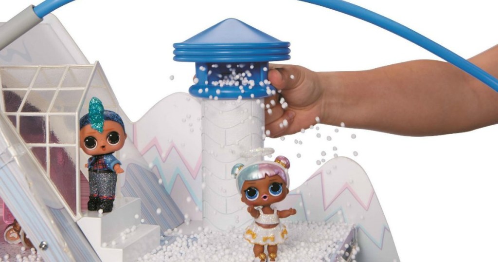 kid playing with chimney on LOL Surprise Winter Chalet