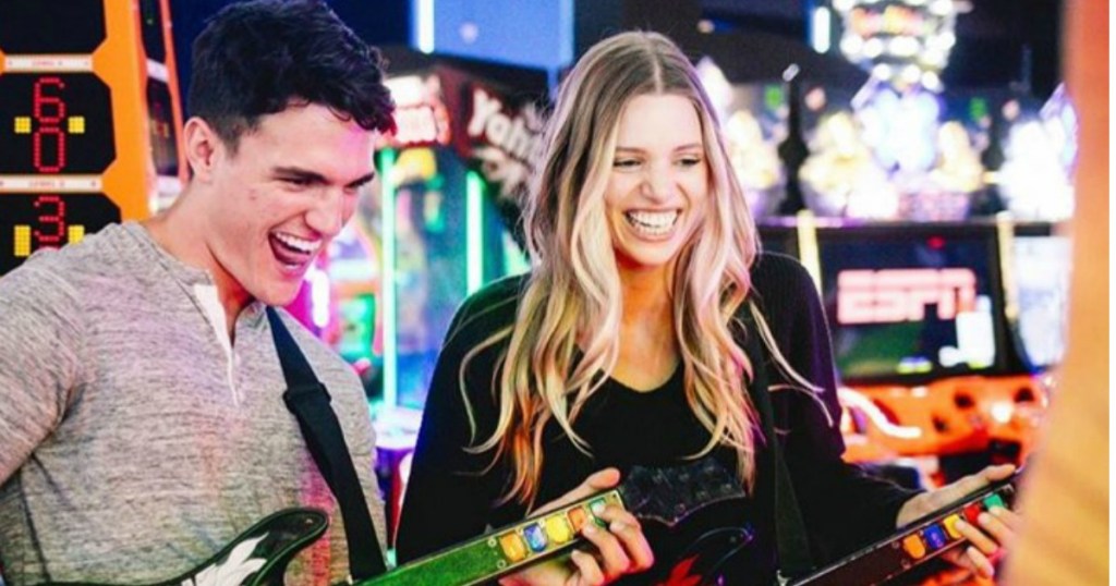 Man and woman on a date at Dave & Buster's playing games