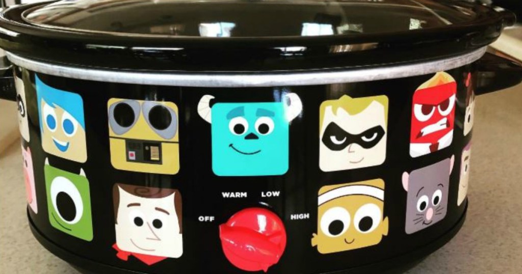 disney characters on black crockpot on counter