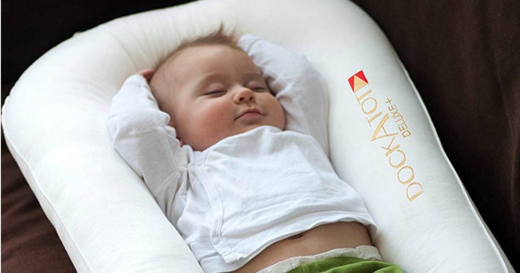 Baby sleeping in a Dock a Tot Deluxe
