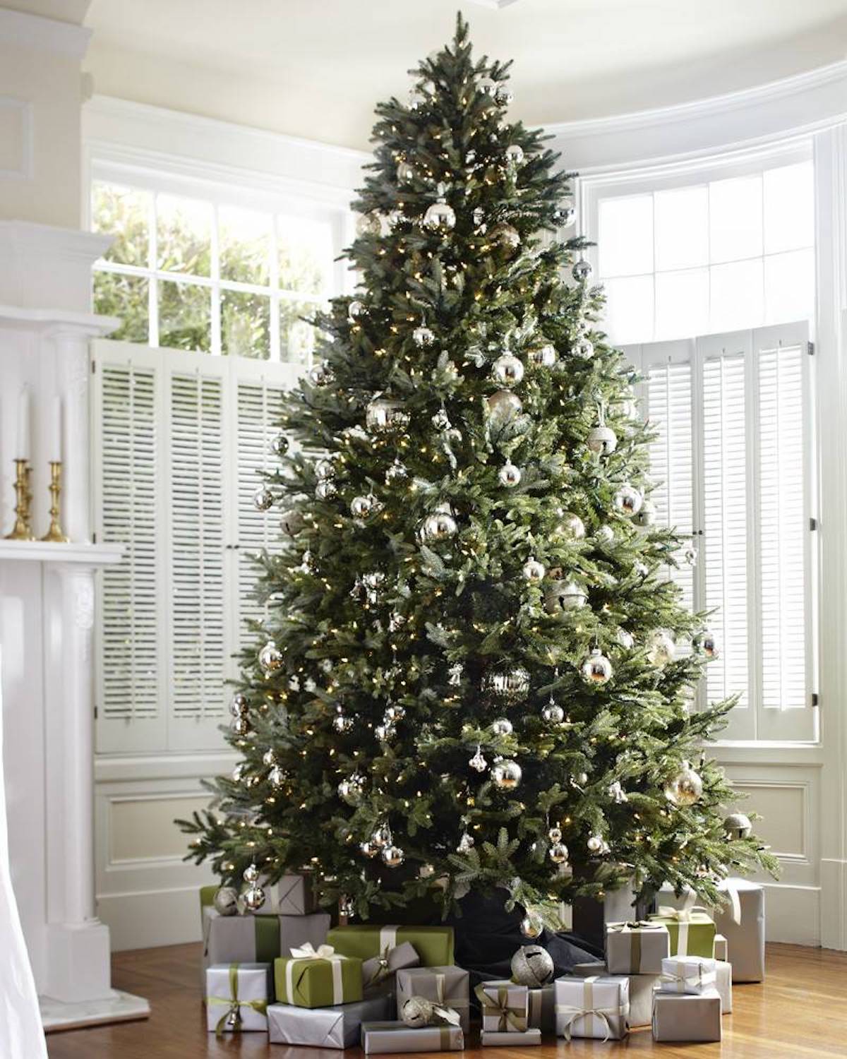 artificial christmas tree with ornaments and wrapped presents