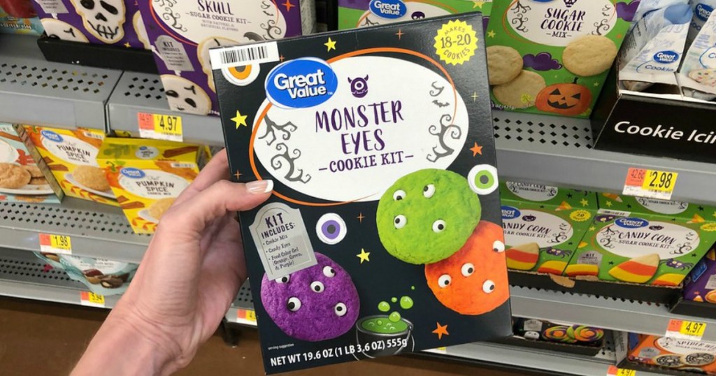 woman holding Great Value Monster Eyes Cookie Kit in walmart