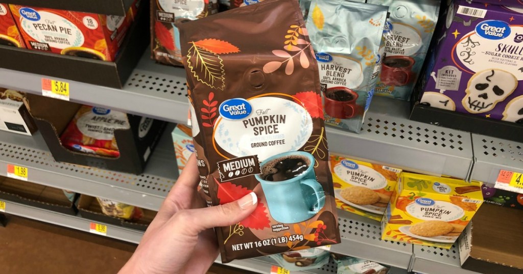 woman holding Great Value Pumpkin Spice Ground Coffee bag at Walmart