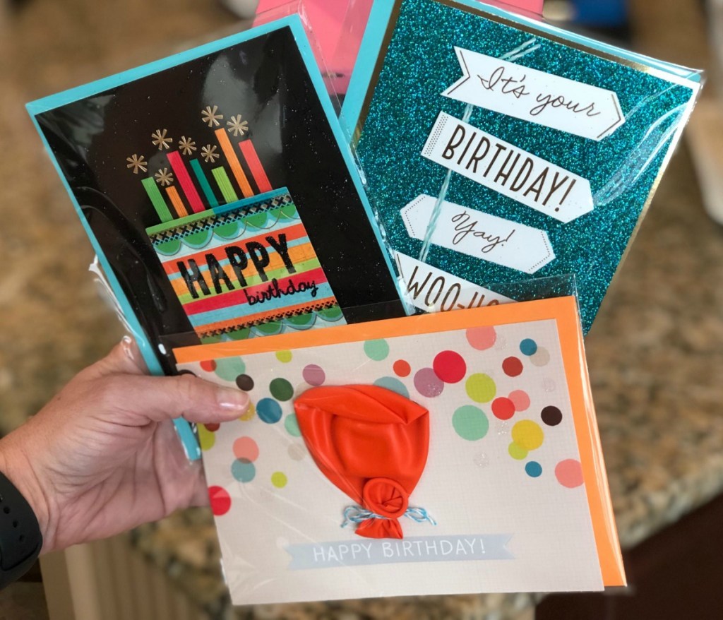 Three Hallmark Birthday Cards in hand