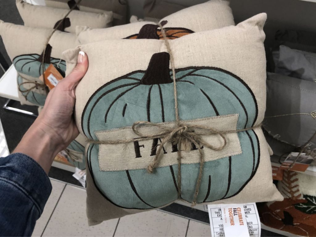 woman hand holding Harvest Pumpkin Pillow 3-piece Set