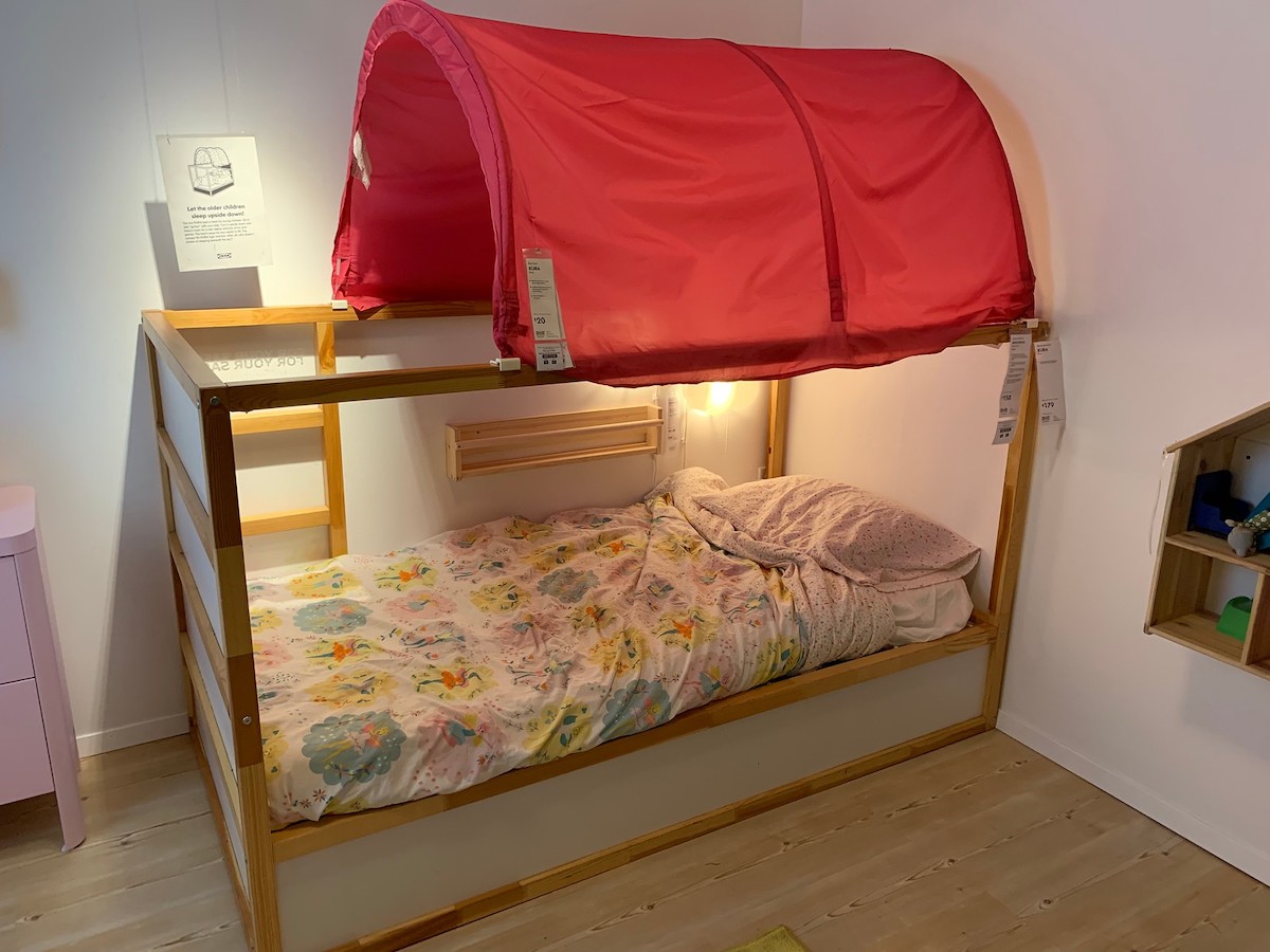 KURA reversible bed with red tent canopy and lights