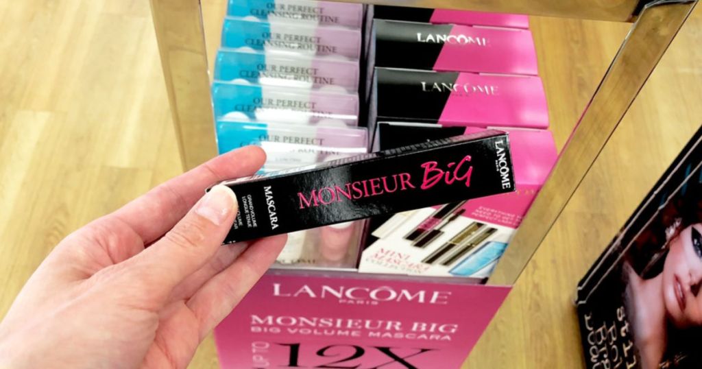 woman holding Lancôme Monsieur Big Mascara in store