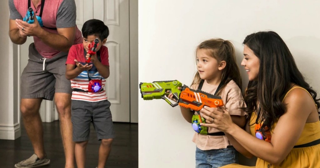 Family playing laser tag in the house
