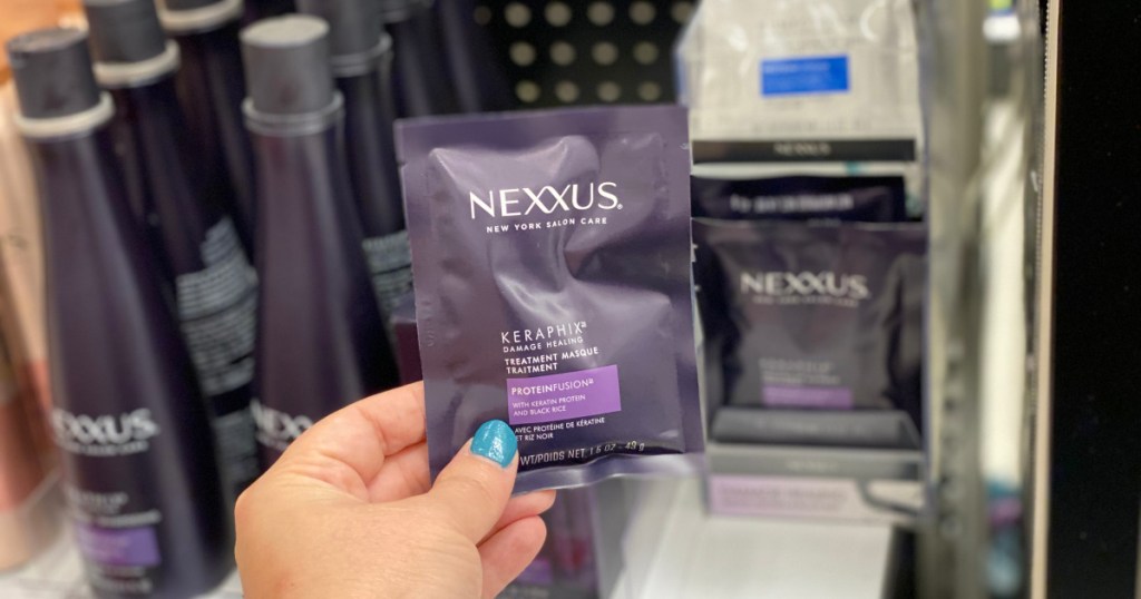 hand holding up nexxus hair mask