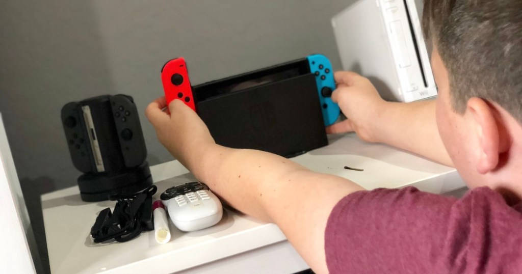 kid playing with nintendo switch 