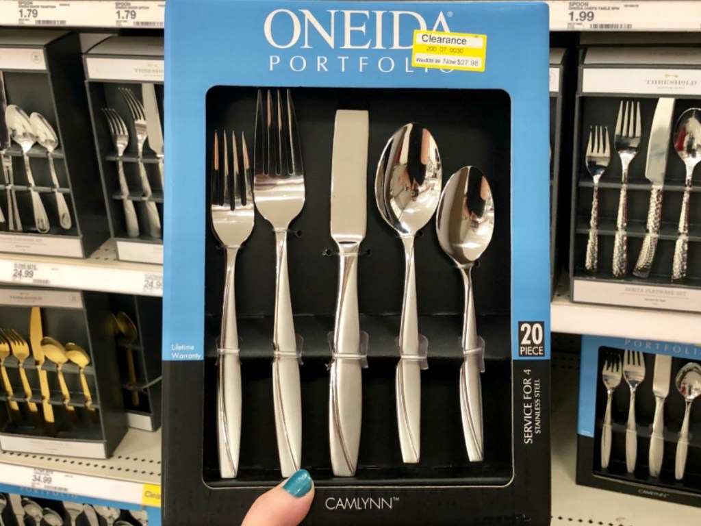 hand holding box of silverwear up in store