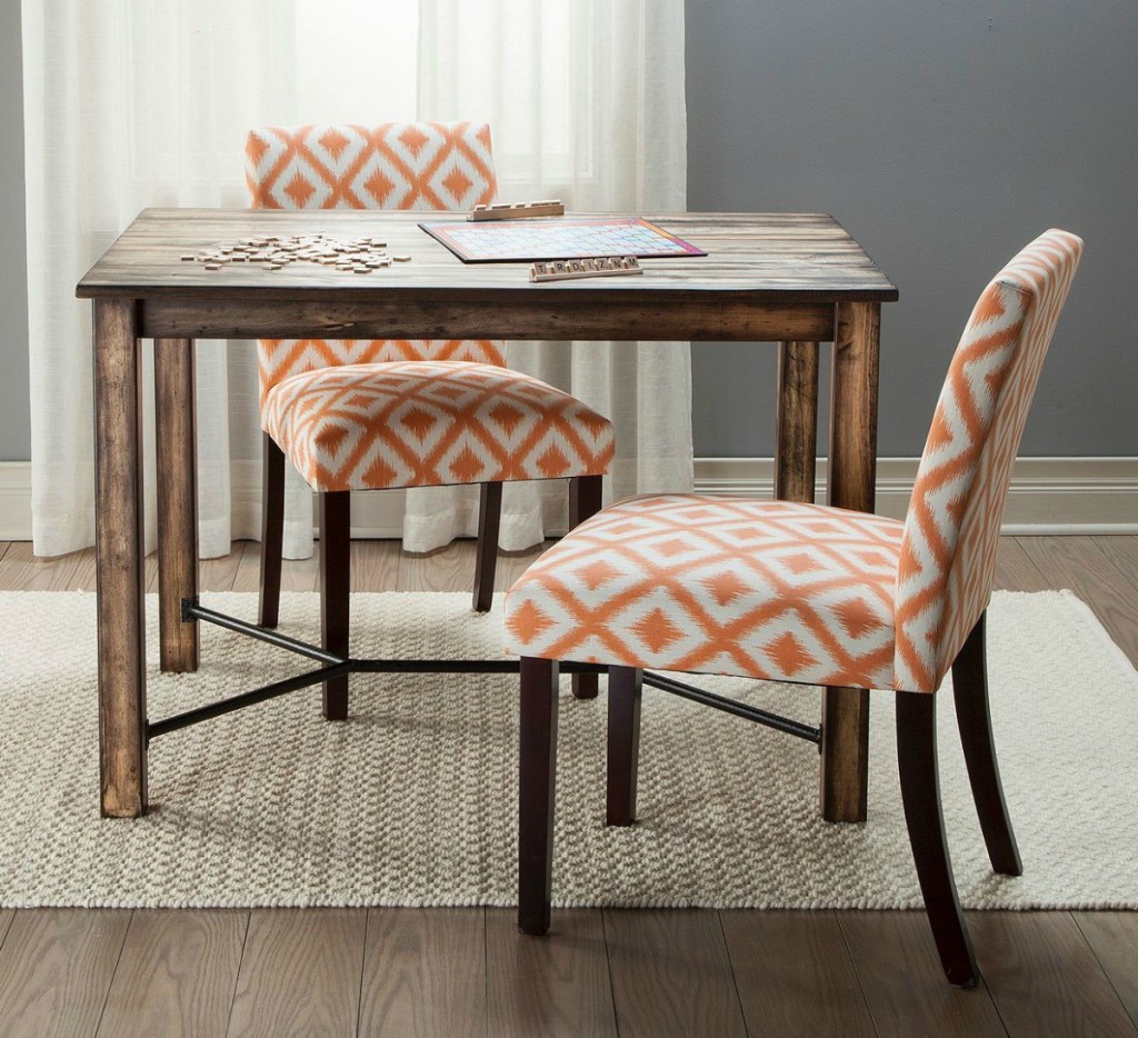 brown dining table with accent chairs