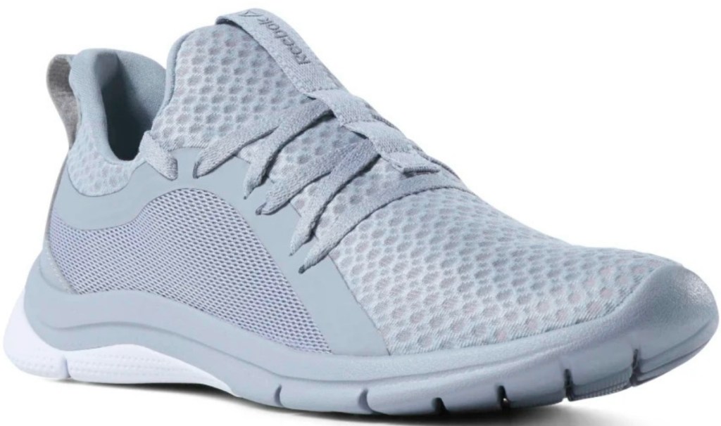 Women's Reebok brand running shoes in lilac color