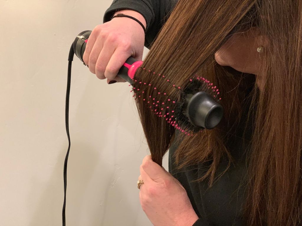 woman using Revlon Hair Dryer And Volumizer in bathroom