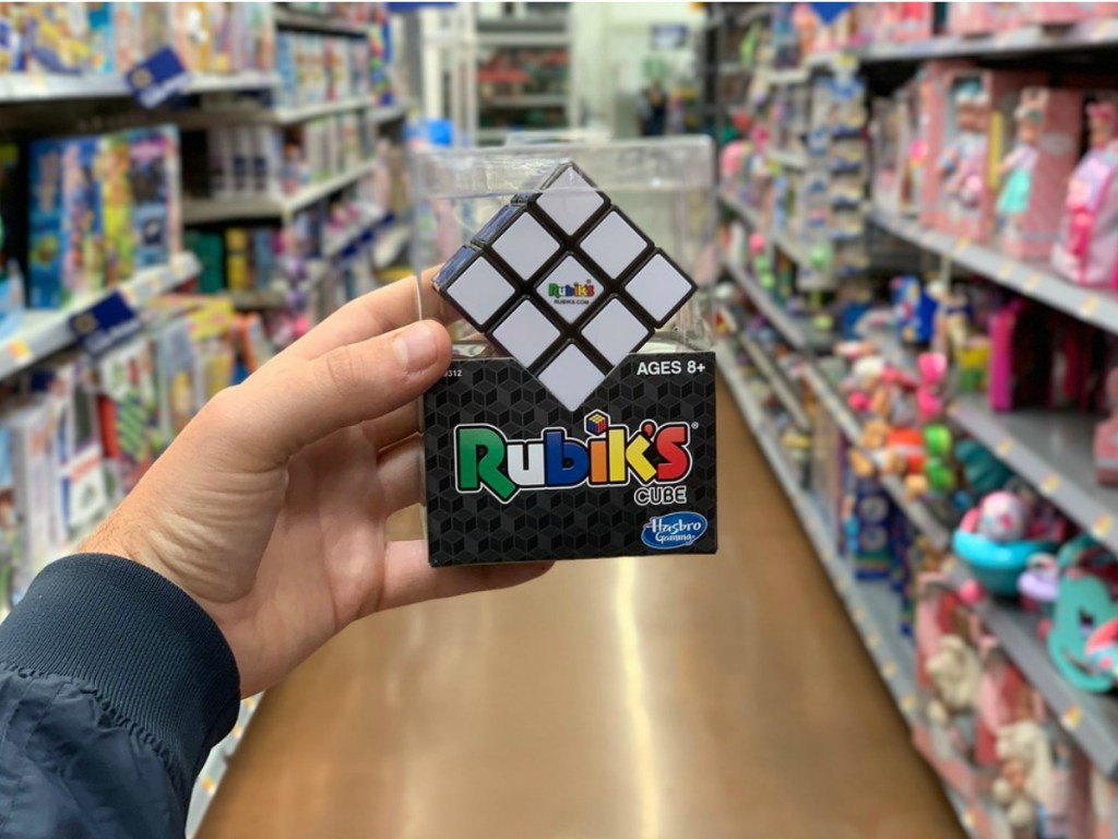 man holding a Rubik's cube at Walmart