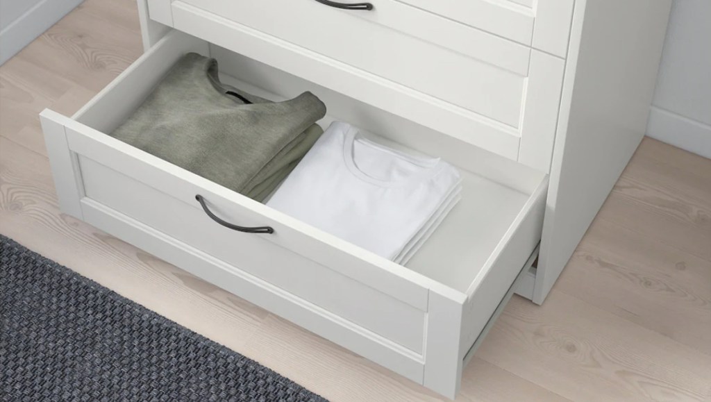 green and white shirts in bottom drawer of IKEA bedroom dresser