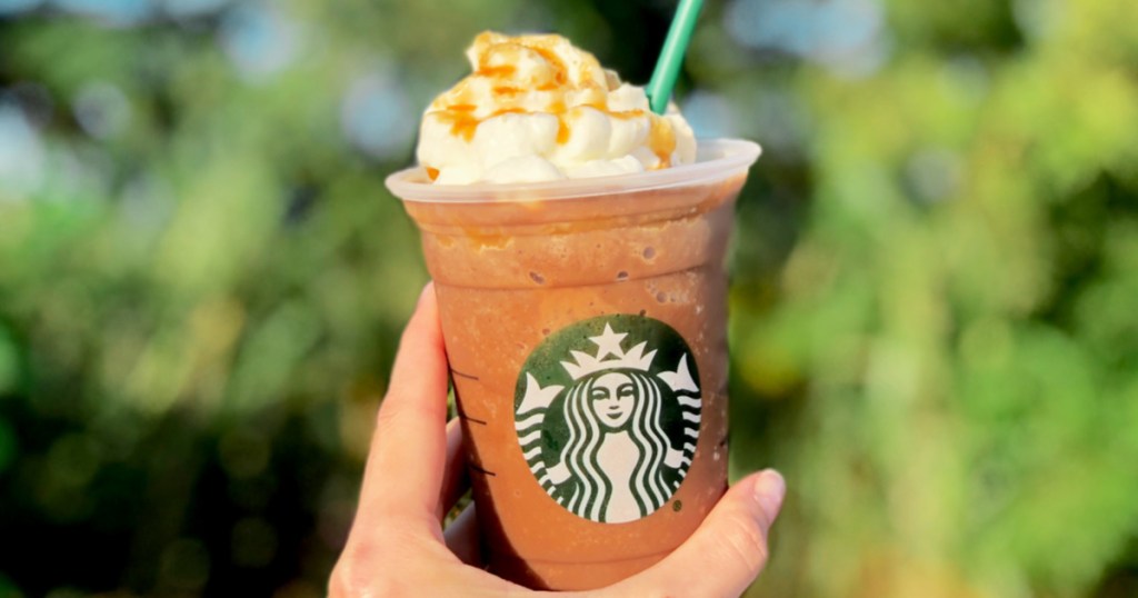 hand holding pumpkin spiced latte
