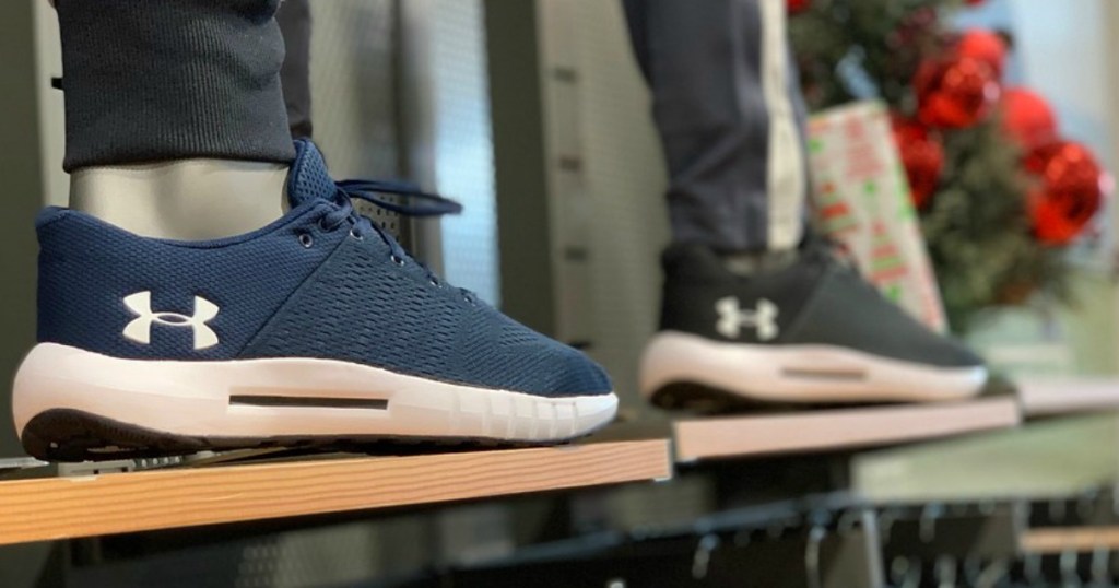 two pairs of under armour sneakers