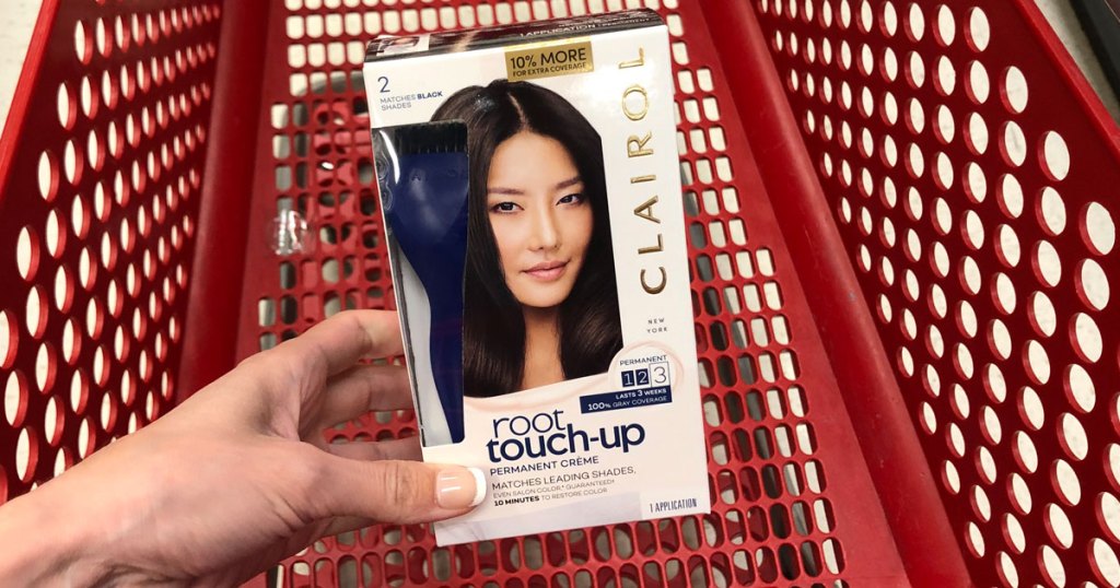 hand holding box of clairol root touch up