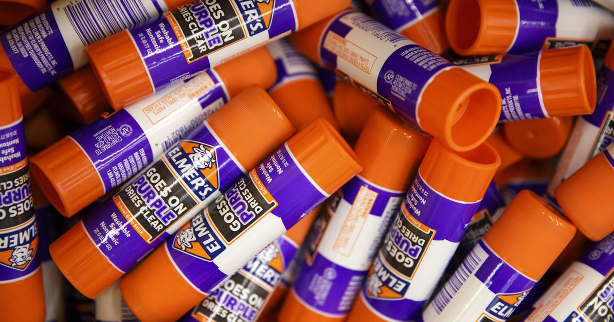 close up of several elmer's disappearing purple glue sticks