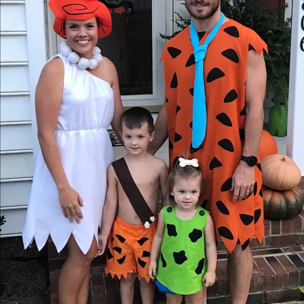 family wearing the flinestones costumes