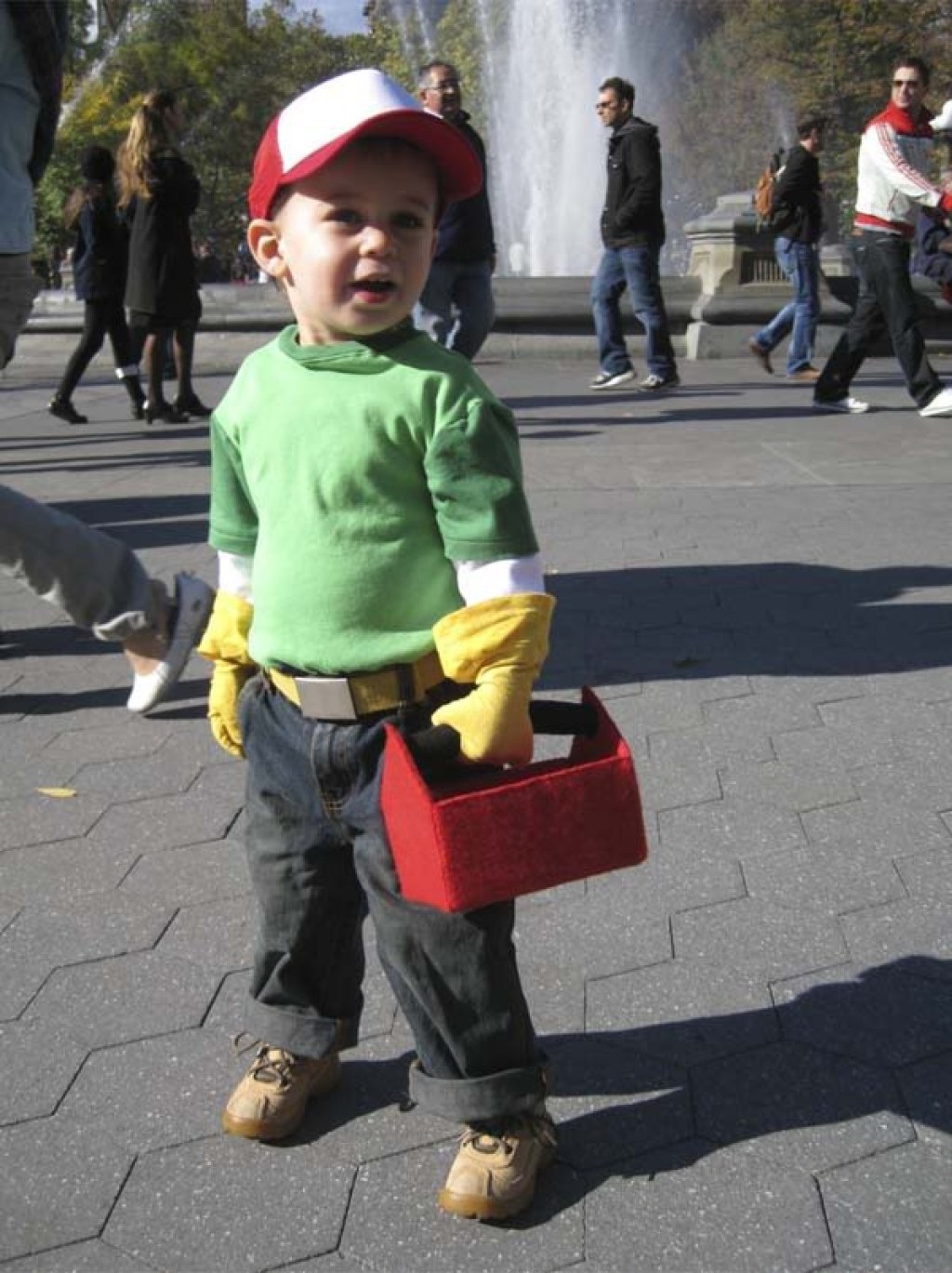boy wearing handy manny costume