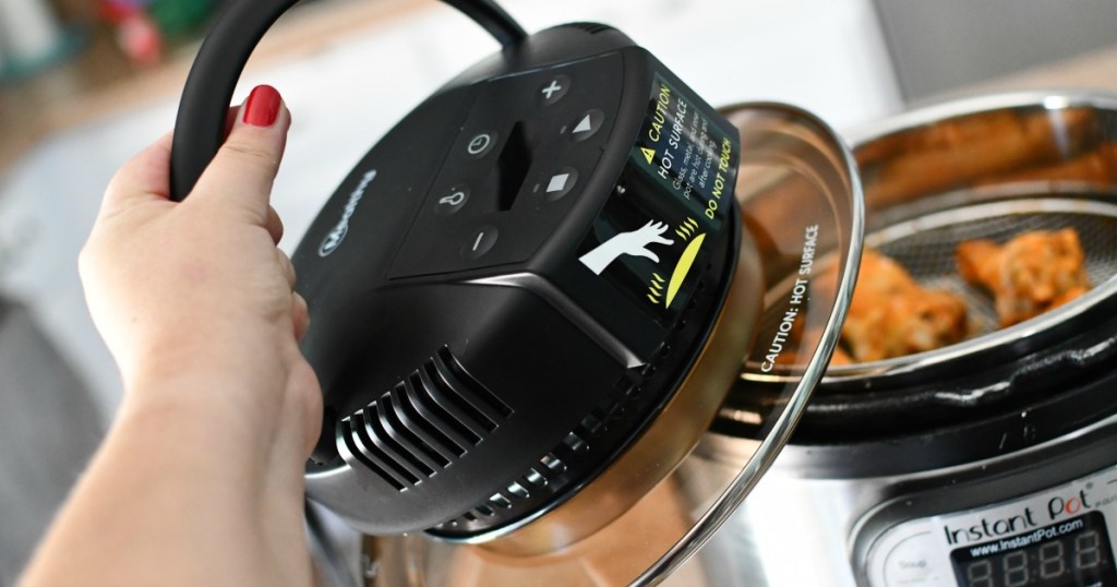 woman removing air fryer lid from Instant Pot