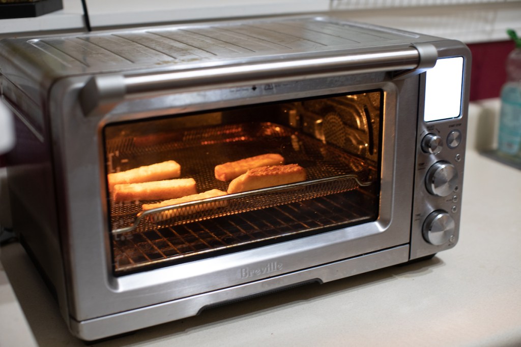 stainless steel air fryer sitting on counter