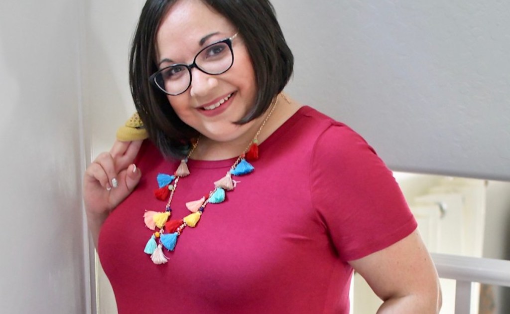 lina wearing colorful multicolor tassel necklace with red dress