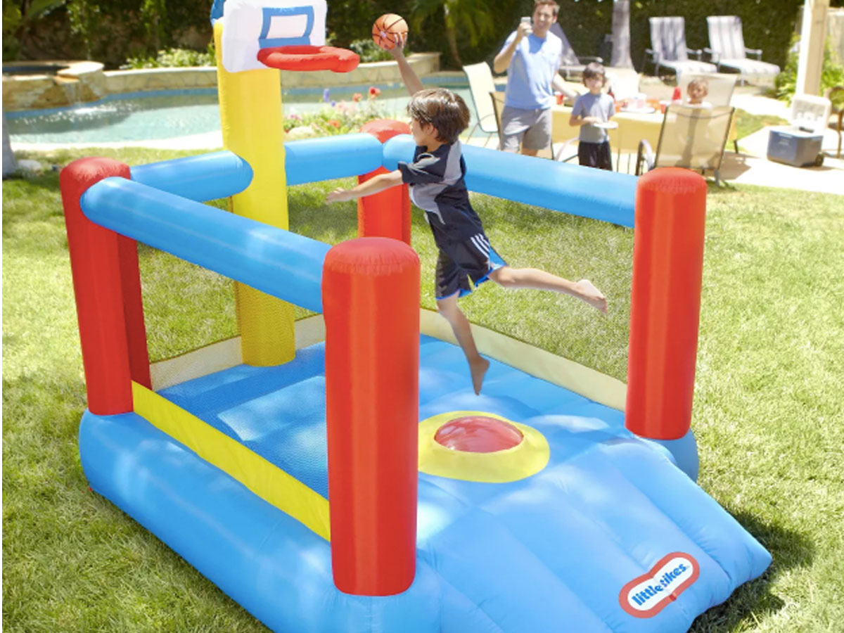 little tike slam n dunk bounce house outside with kids playing