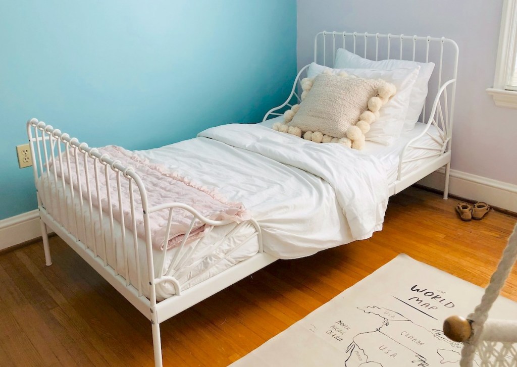 white iron MINNEN IKEA bed with white bedding