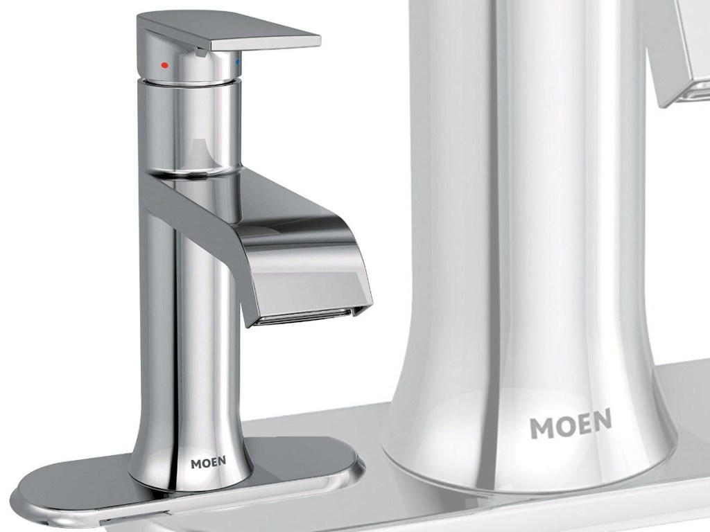 silver sink faucet with shadowed background