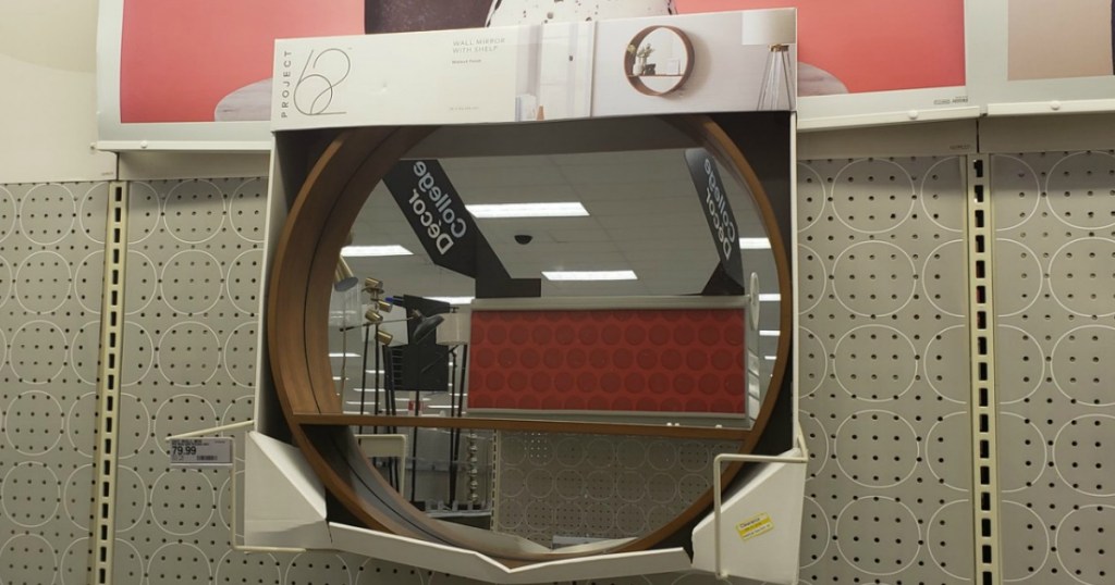 round wooden mirror and shelf