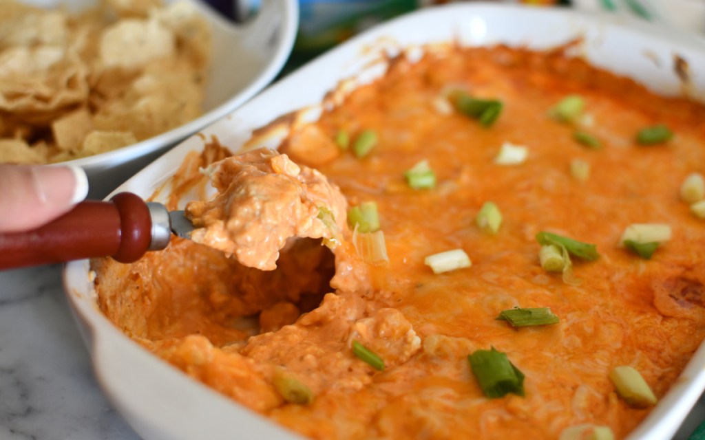 scooping buffalo chicken dip