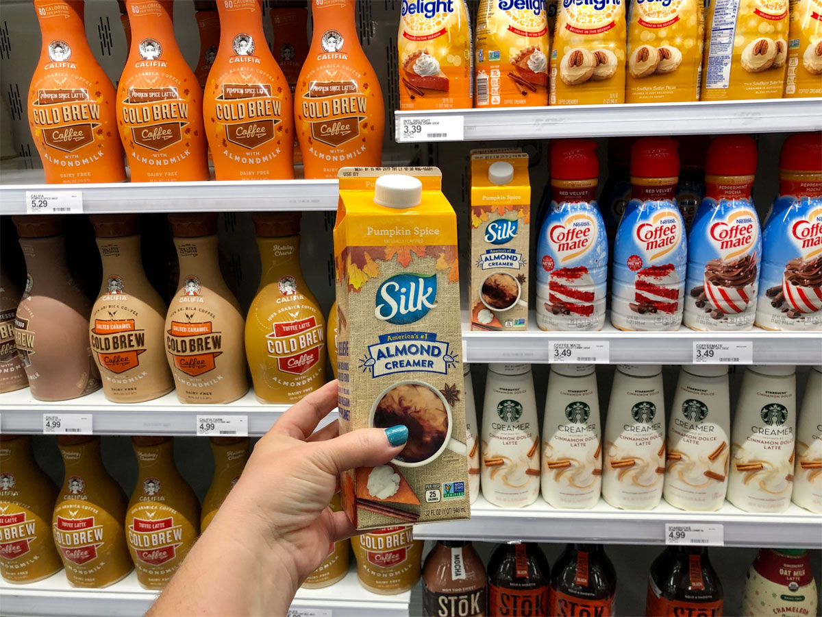 hand holding silk almond creamer pumpkin spice at target