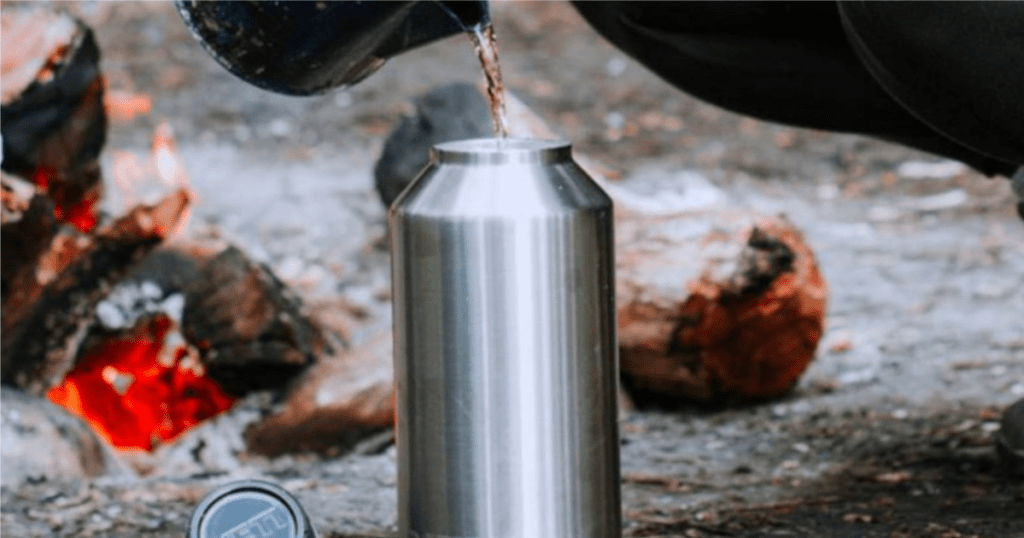 coffee pouring into yeti rambler at campsite