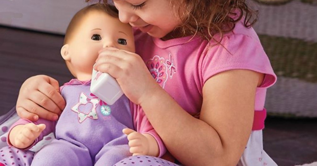 girl holding American Girl Bitty Baby