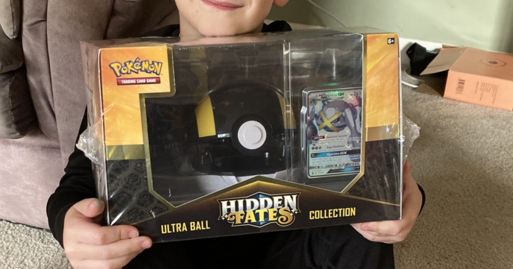 Little Boy Holding Pokemon game