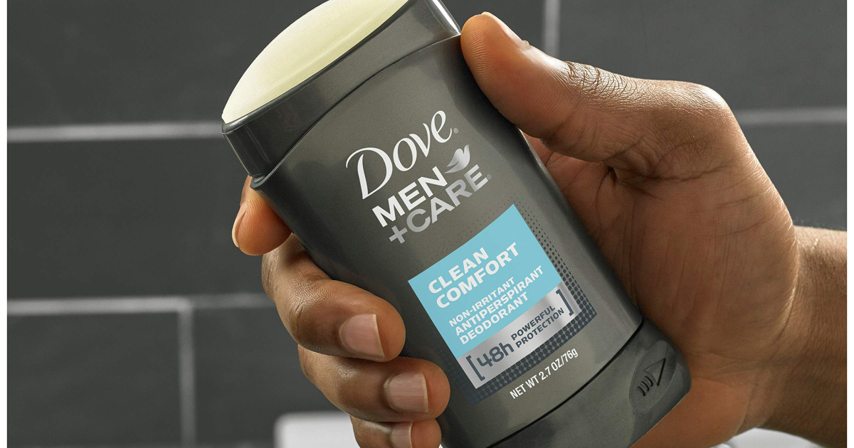 hand holding dove men + care deodorant stick in a shower