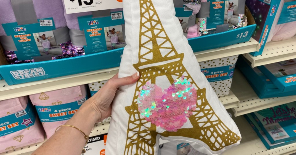 hand holding up dream street eiffel tower throw pillow