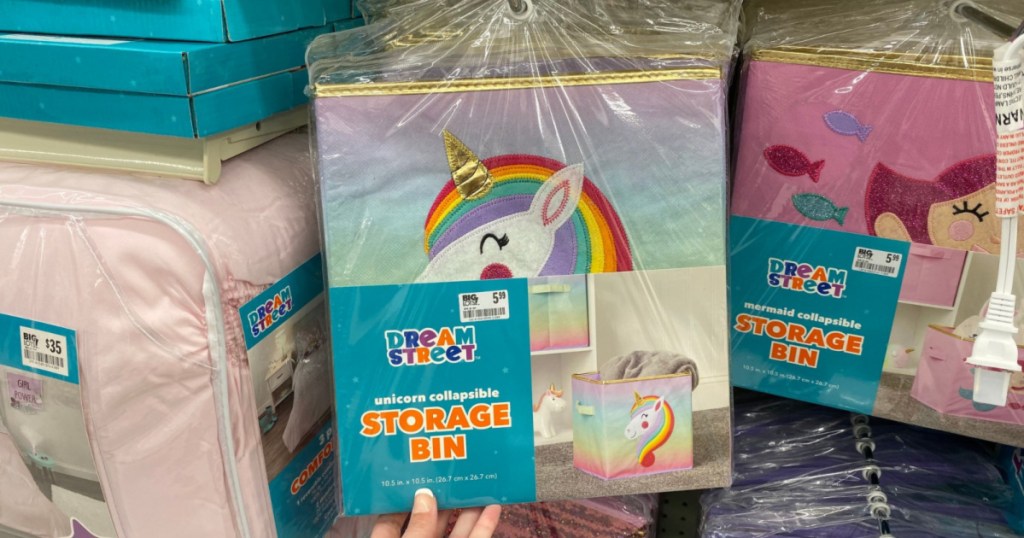 hand holding up unicorn fabric storage bin