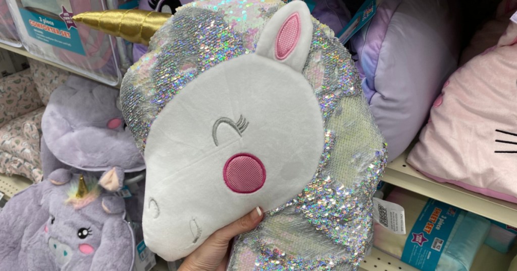 hand holding up unicorn throw pillow at big lots