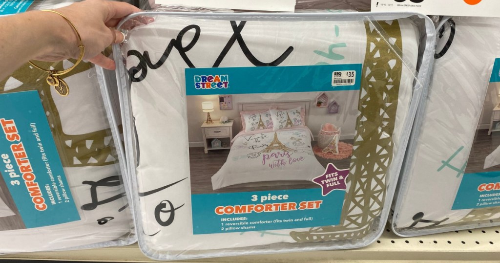 hand holding up dream street comforter set at big lots