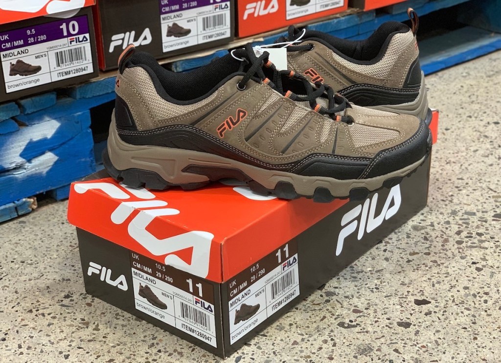 brown tan men's FILA shoes on shoebox in store
